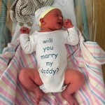 Dad takes newborn son’s help to propose to Mom
