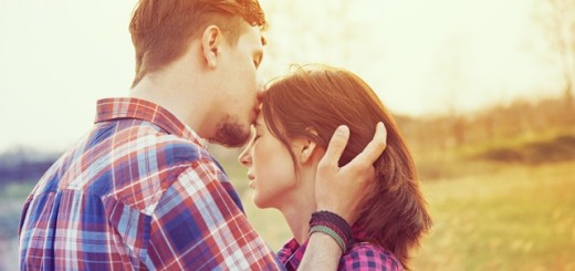 man kissing a woman's forehead_New_Love_Times