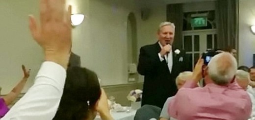 john serenading his surprised daughter at her wedding reception