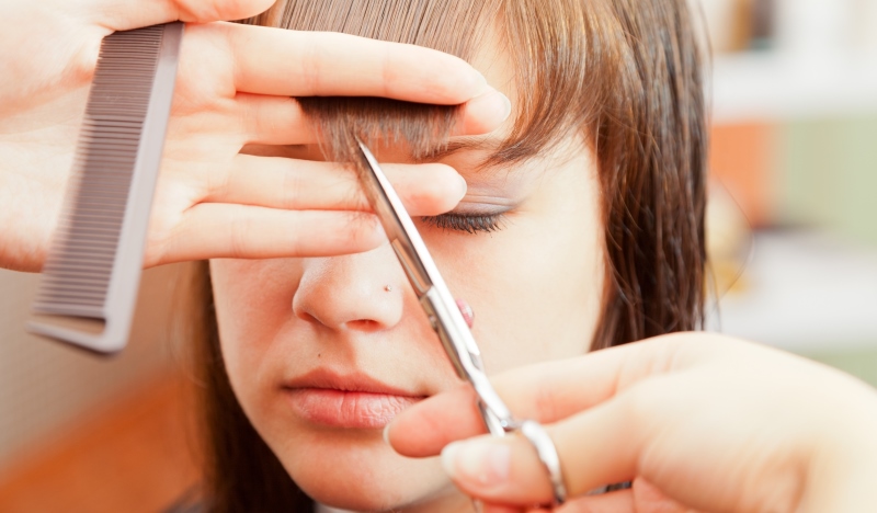 Woman getting hair cut