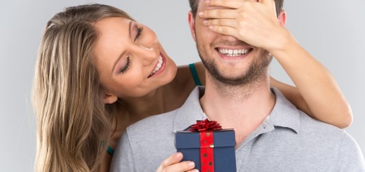 woman giving a gift to a man