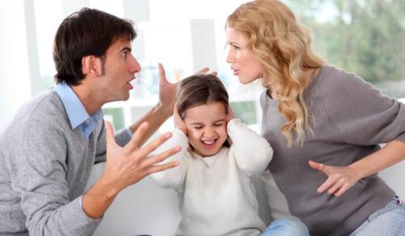 couple fighting in front of their kid