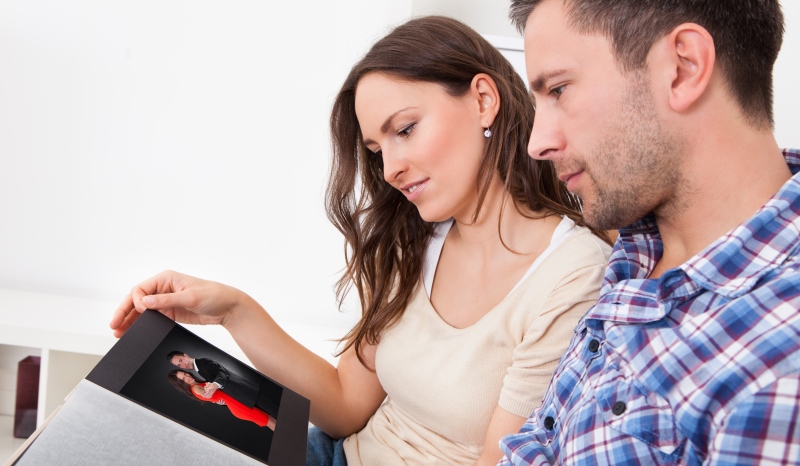 couple looking at an album