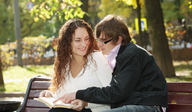 couple reading on a bench_New_Love_Times