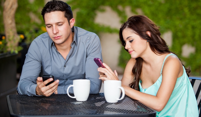 couple staring at their phones_New_Love_Times