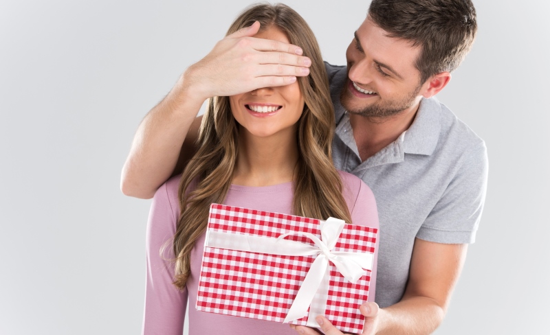 man giving a gift to a woman
