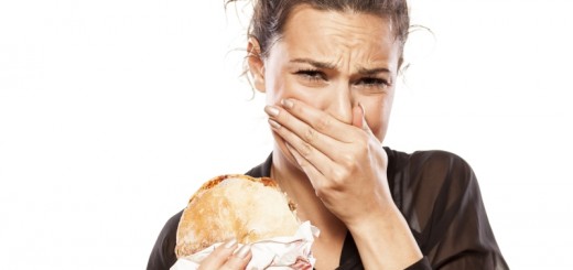 woman making a face while eating