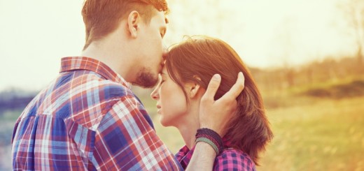 man kissing a woman's forehead_New_Love_Times