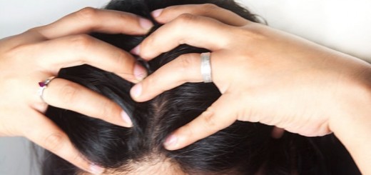 woman massaging her scalp