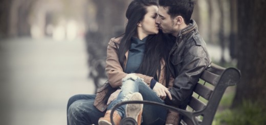 couple cuddling on a bench_New_Love_Times