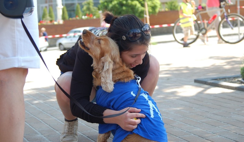 girl hugging a dog_New_Love_Times