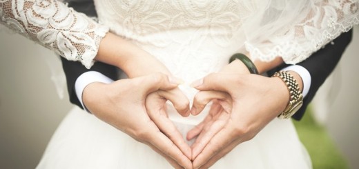 couple forming a heart with their hands_New_Love_Times