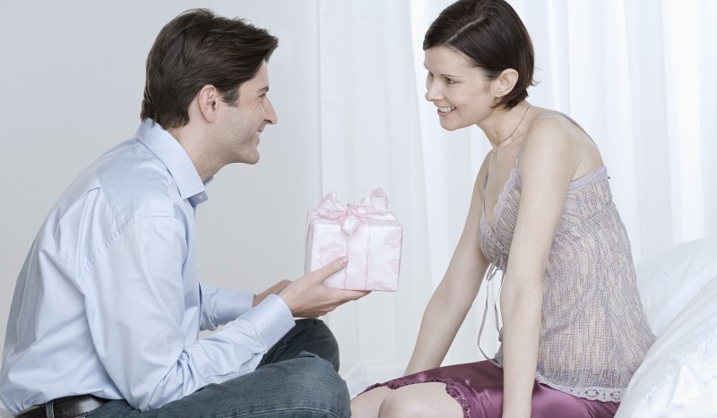 man giving a gift to a woman_New_Love_Times