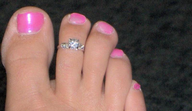 woman wearing toe rings