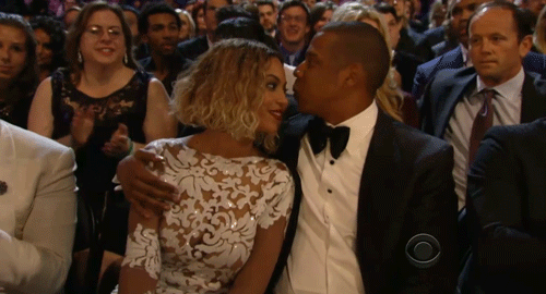 jay z kissing wife beyonce at a public event