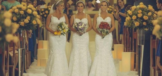 the triplet sisters walking down the aisle in similar wedding dresses, makeup, and hairstyles