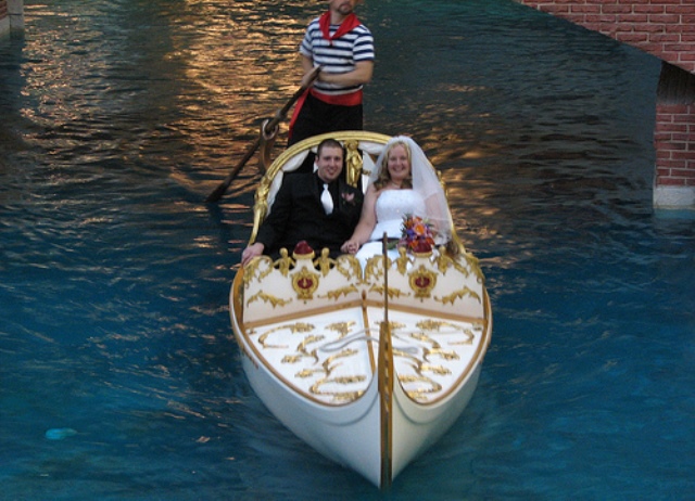 a newlywed couple in a gondola