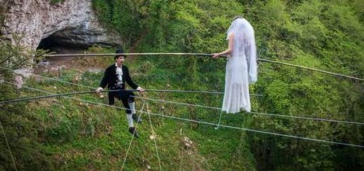 phoebe baker making her way towards her groom chris bull, on a high wire