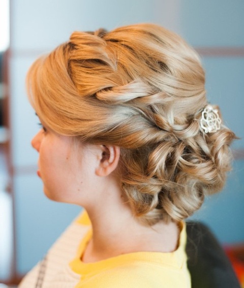 Twisted rolled back updo with jewel