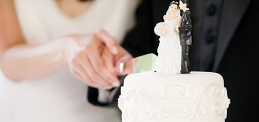 couple cutting wedding cake_New_Love_Times