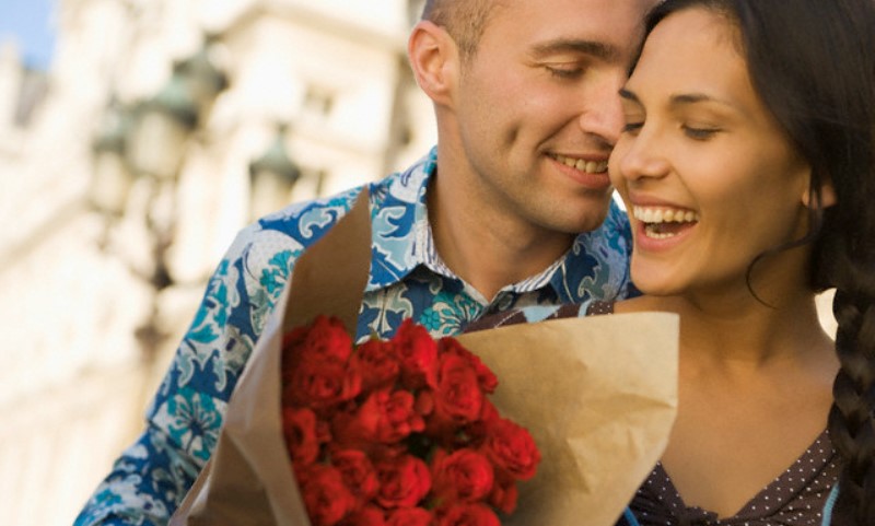 man giving flowers to a woman_New_Love_Times