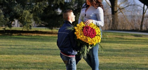 man giving flowers to woman