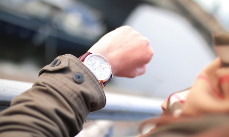 woman looking at her watch