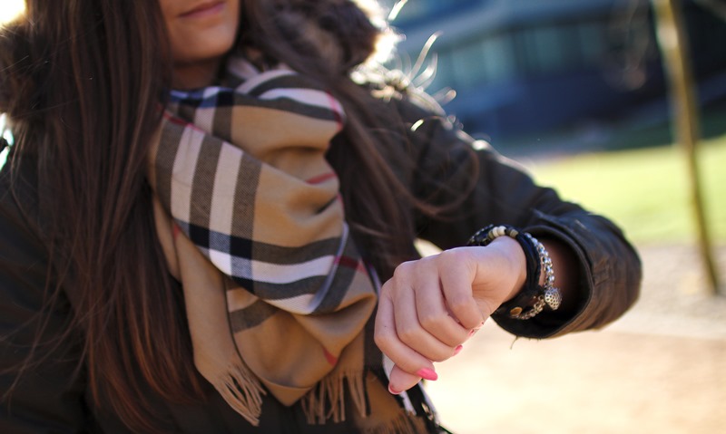 woman looking at her watch