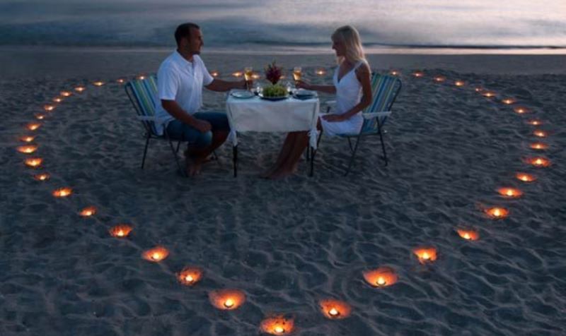 couple having dinner on a beach_New_Love_Times