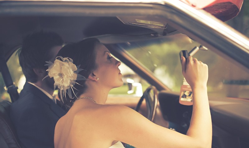 woman checking her makeup