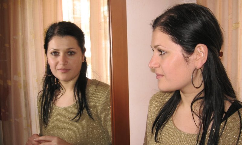 woman looking in mirror_New_Love_Times