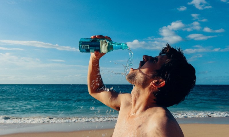 man drinking water