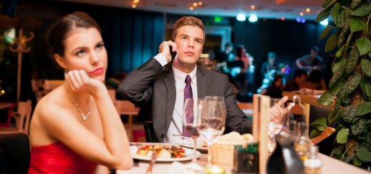 man talking on the phone while on a date_New_Love_Times