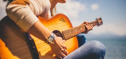 woman playing a guitar_New_Love_Times