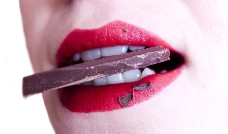 woman eating chocolate_New_Love_Times